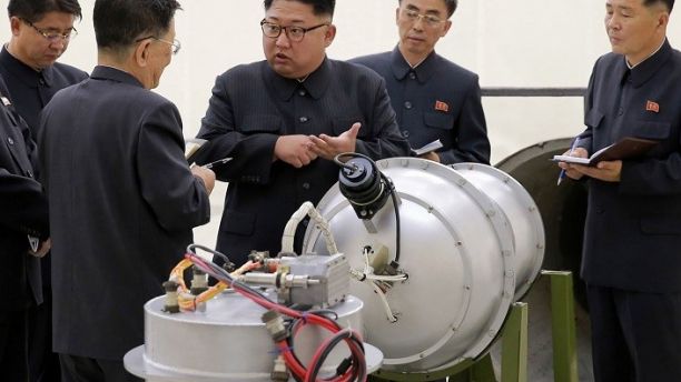 FILE - This undated file photo distributed by the North Korean government shows North Korean leader Kim Jong Un, center, at an undisclosed location in North Korea. The world is wondering if North Koreaâs next nuclear test will involve a nuclear missile screaming over Japan after the North said it may test a hydrogen bomb in the Pacific Ocean. Independent journalists were not given access to cover the event depicted in this image distributed by the Korean Central News Agency via Korea News Service. The content of this image is as provided and cannot be independently verified. (Korean Central News Agency/Korea News Service via AP, File)