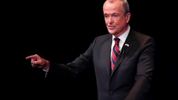 Democratic nominee Phil Murphy answers a question during a gubernatorial debate against Republican nominee Lt. Gov. Kim Guadagno at the New Jersey Performing Arts Center, Tuesday, Oct. 10, 2017, in Newark, N.J. (AP Photo/Julio Cortez, pool)