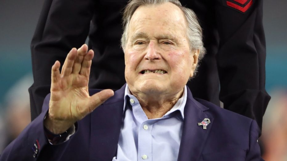 Former President George H.W. Bush arrives on the field ahead of Super Bowl LI, in Houston, Feb. 5, 2017.