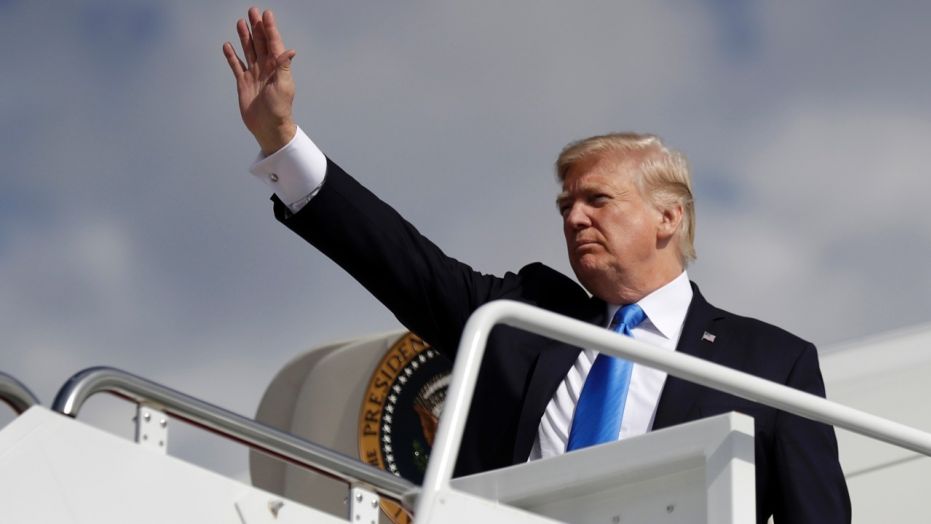 President Donald Trump waves as he prepares to board Air Force One for a trip to Dallas, Wednesday, Oct. 25, 2017, at Andrews Air Force Base, Md. (AP Photo/Evan Vucci)