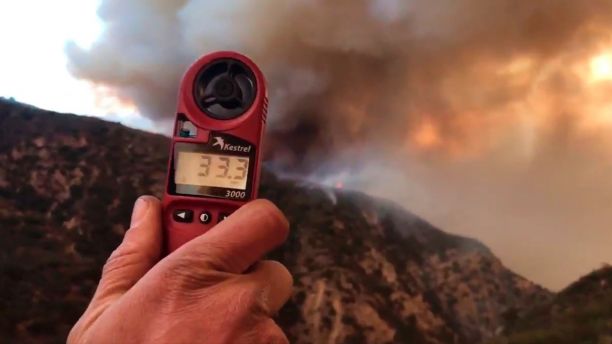 In this image from video provided by the Santa Barbara County Fire Department, a wind speed indicator held by a U.S. Forest Service fire fighter on Gibraltar Road at the W. Fork of Cold Spring Trail, shows just how fast and varied the speed of the wind is blowing down canyon. In this video it varied from 10-33 mph in Santa Barbara, Calif., Saturday, Dec. 16, 2017. Wind gusts of up to 52 mph have been recorded in the area using a hand held weather device. The Office of Emergency Services announced the orders Saturday as Santa Ana winds pushed the fire close to the community. The mandatory evacuation zone is now 17 miles long and up to 5 miles wide, extending from coastal mountains northwest of Los Angeles to the ocean. Winds in the foothill area are hitting around 30 mph, with gusts up to 60 mph. (Mike Eliason/Santa Barbara County Fire Department via AP)