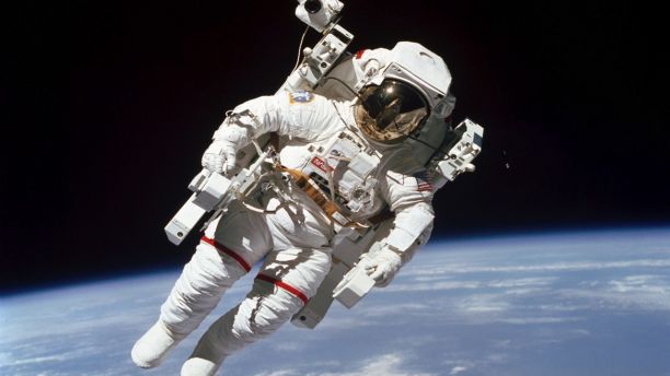 This Feb. 7, 1984 photo made available by NASA shows astronaut Bruce McCandless II, participating in a spacewalk a few meters away from the cabin of the Earth-orbiting space shuttle Challenger, using a nitrogen-propelled Manned Maneuvering Unit. The Johnson Space Center says McCandless died Thursday, Dec. 21, 2017 in California. (NASA via AP)