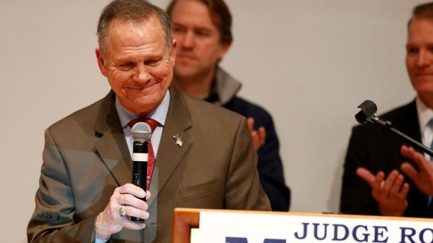 Republican U.S. Senate candidate Roy Moore pauses as he addresses supporters at his election night party in Montgomery, Alabama, U.S., December 12, 2017. REUTERS/Jonathan Bachman - RC1EEEE586B0