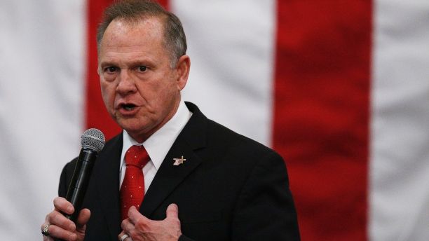 FILE- In this Dec. 11, 2017, file photo, U.S. Senate candidate Roy Moore speaks at a campaign rally in Midland City, Ala.  Moore is telling supporters âthe battle is not overâ in Alabamaâs Senate race as he asks for campaign donations and any reports of voting irregularities. Moore in a Friday, Dec. 15, fundraising email asked supporters to contribute to his âelection integrity fundâ and tell them of any problems at the polls. (AP Photo/Brynn Anderson, File)