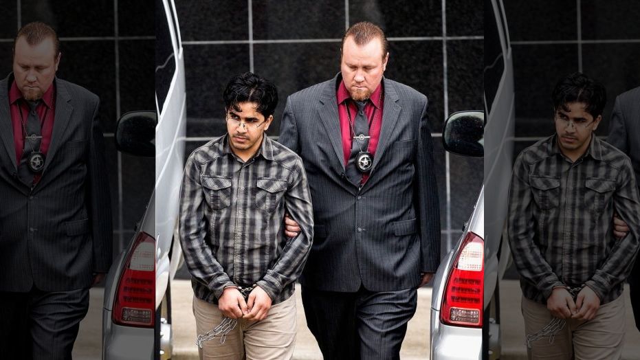 Omar Faraj Saeed Al Hardan, left, is escorted by U.S. Marshals from the Bob Casey Federal Courthouse on Friday, Jan. 8, 2016, in Houston.