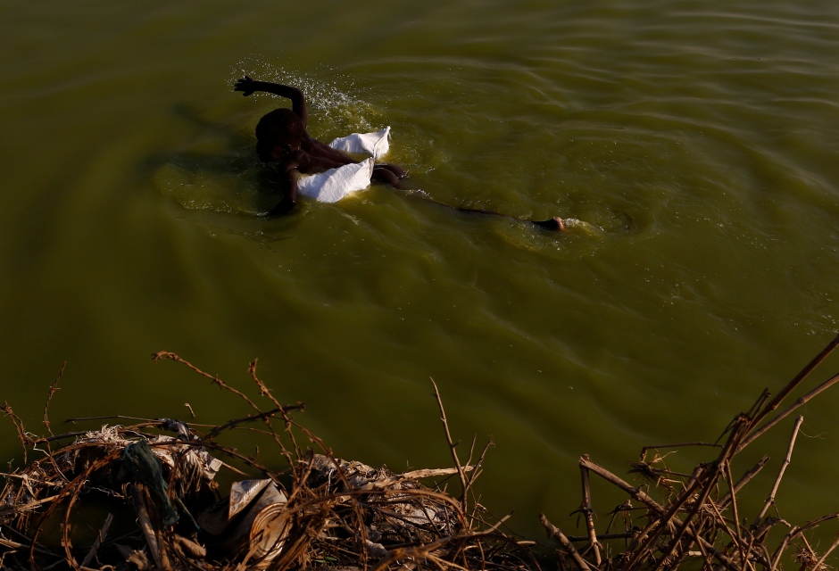 SOUTH SUDAN WAR child swims in United Nations Mission