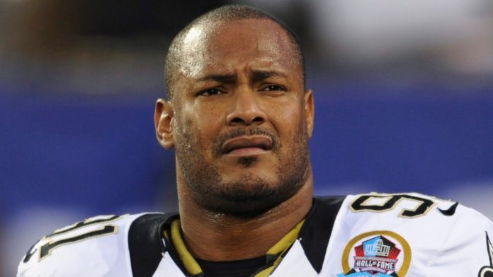 saints-will-smith-shot-football.jpg