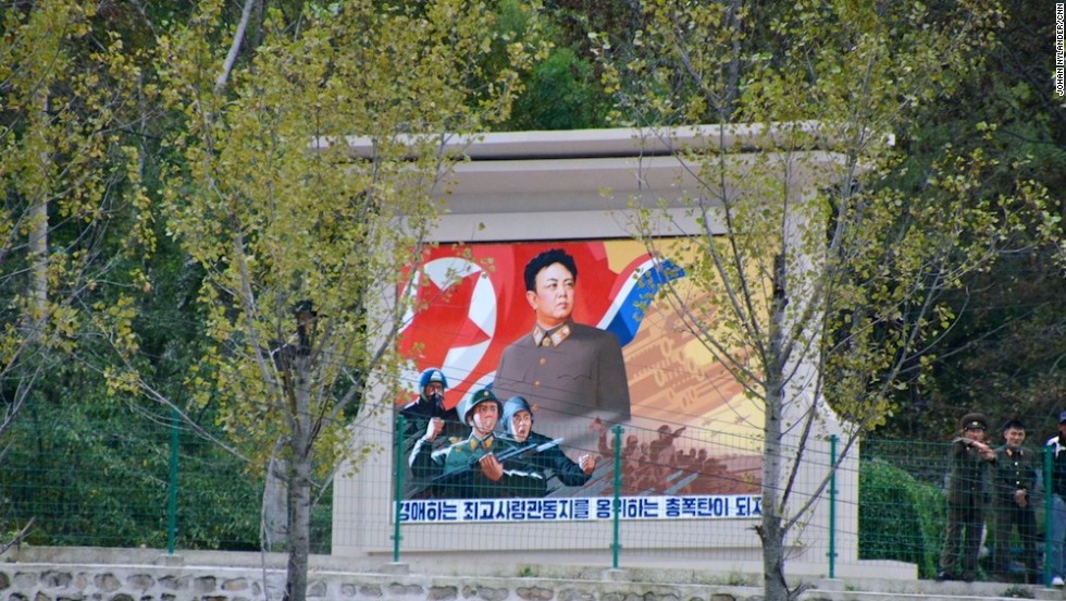 This propaganda monument of "Dear Leader" Kim Jong-Il by a countryside road, not far from the border to China, was deleted by authorities. North Korea required images of leaders be full body shots.