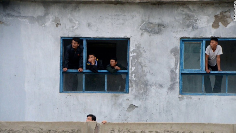 In the city of Rason, people are leaning out of windows to get a glimpse of the Western cyclists.