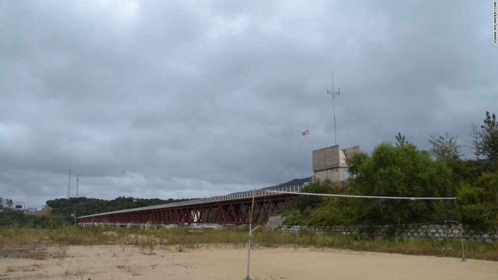 By the border checkpoint next to the Tumen River, North Korean customs officials can play volleyball. Officials prohibited any photos of North Korean military bases.