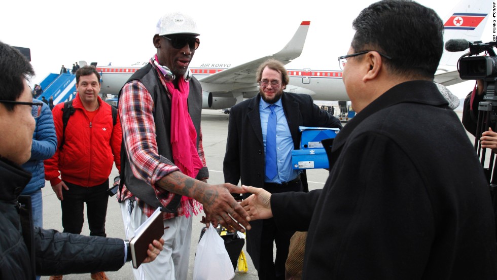 Son Kwang Ho, vice minister of North Korea's Sports Ministry, greets former NBA star Dennis Rodman at the airport in Pyongyang on Monday, January 6.