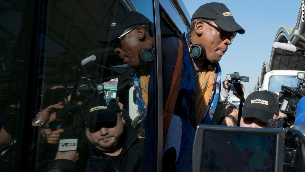 Rodman arrives at Beijing's airport before his flight to North Korea on December 19.