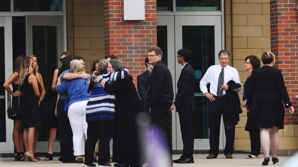Mourners arrive for the funeral of Otto Warmbier, Thursday, June 22, 2017, in Wyoming, Ohio. Warmbier, a 22-year-old University of Virginia student who was sentenced in March 2016 to 15 years in prison with hard labor in North Korea, died this week, days after returning to the United States. (AP Photo/Bryan Woolston)