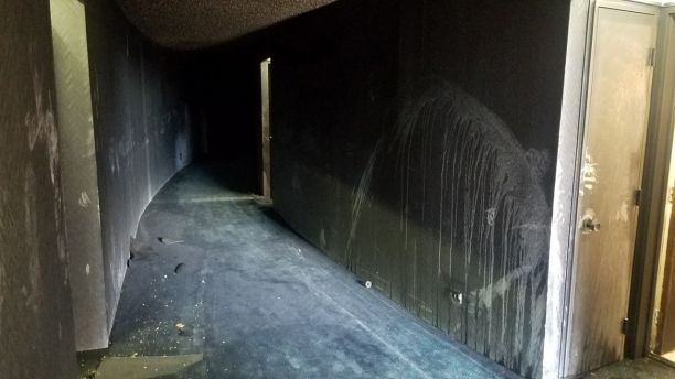 In this photo provided by KITV, fire damage from a blaze that killed three people and left 12 injured in the Marco Polo building in Honolulu is shown on Saturday, July 15, 2017. The fire broke out Friday afternoon in a unit on the 26th floor, where all three of the dead were found, Fire Chief Manuel Neves said. The building is not required to have fire sprinklers, which would have confined the blaze to the unit where it started, Neves said. The 36-floor building near the tourist mecca of Waikiki was built in 1971, before sprinklers were mandatory in high-rises. (Brenton Awa/KITV via AP)