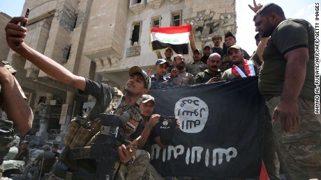 170710153317-iraq-forces-isis-flag-mosul-large-169.jpg