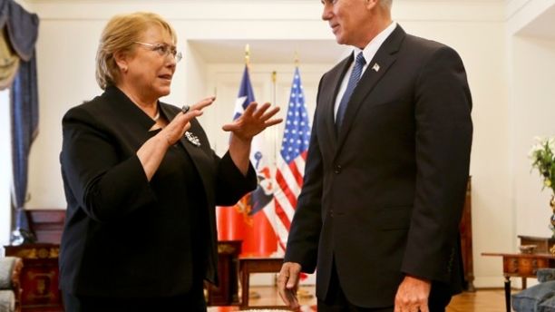 U.S. Vice President Mike Pence, right, chats with Chile's President Michelle Bachellet during a meeting at a La Moneda government palace in Santiago, Chile, Wednesday, Aug. 16, 2017. Pence is on a official visit to Chile until Thursday, when he will be heading to Panama on a week-long visit to Latin America. (AP Photo/Esteban Felix)
