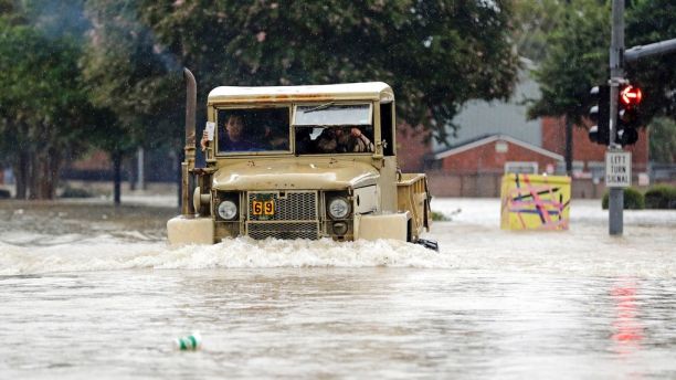 A truck pushes through floodwaters from Tropical Storm Harvey on Sunday, Aug. 27, 2017, in Houston, Texas. (AP Photo/David J. Phillip)