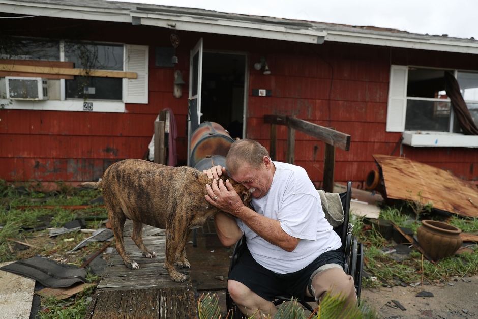 Harvey man cries with his dog Otis