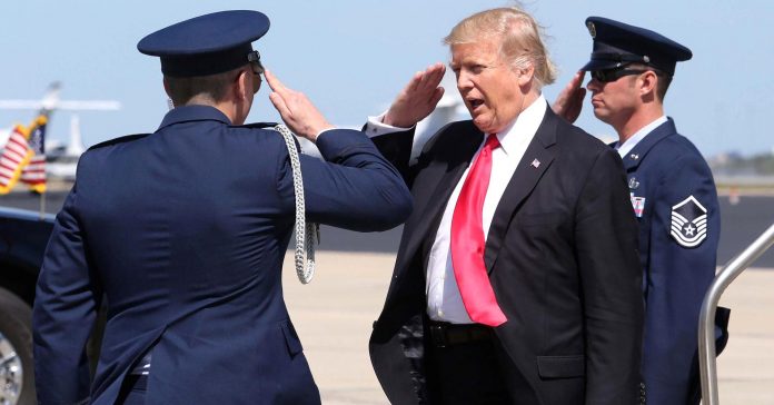 104716689-GettyImages-647550758-trump-salute.1910x1000.jpg