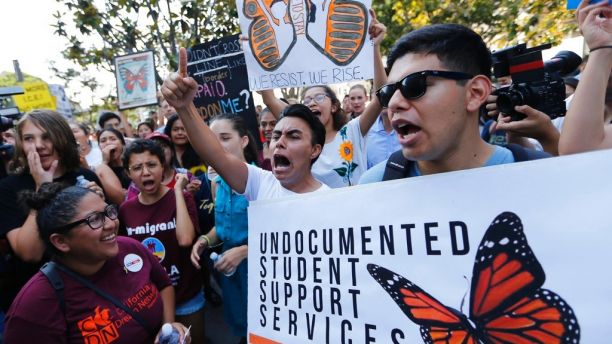 Undocumented students join a rally in support of the Deferred Action for Childhood Arrivals, or DACA program outside the Edward Roybal Federal Building in downtown Los Angeles Friday, Sept. 1, 2017. President Donald Trump says he'll be announcing a decision on the fate of hundreds of thousands of young immigrants who were brought into the country illegally as children in the coming days, immigrants he's calling 