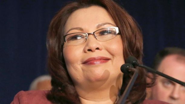 FILE - In this Nov. 8, 2016, file photo, then-Sen.-elect Tammy Duckworth, D-Ill., smiles as she celebrates her win over incumbent Sen. Mark Kirk, during her election night party in Chicago. President Donald Trump's pick for Army secretary isn’t fit to lead the service, a senator wounded in combat said Friday as scrutiny over the nomination intensified. Duckworth, who lost her legs and partial use of her right arm during the Iraq war, said she’s opposing Mark Green’s nomination over his insensitive remarks and attitudes toward LGBT Americans and Muslims. (AP Photo/Charles Rex Arbogast, file)