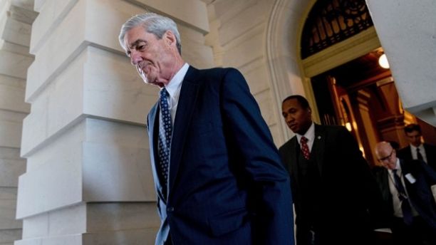 FILE- In this June 21, 2017, file photo, former FBI Director Robert Mueller, the special counsel probing Russian interference in the 2016 election, departs Capitol Hill following a closed door meeting in Washington. A grand jury used by Mueller has heard secret testimony from a Russian-American lobbyist who attended a June 2016 meeting with President Donald Trump's eldest son, The Associated Press has learned. (AP Photo/Andrew Harnik, File)