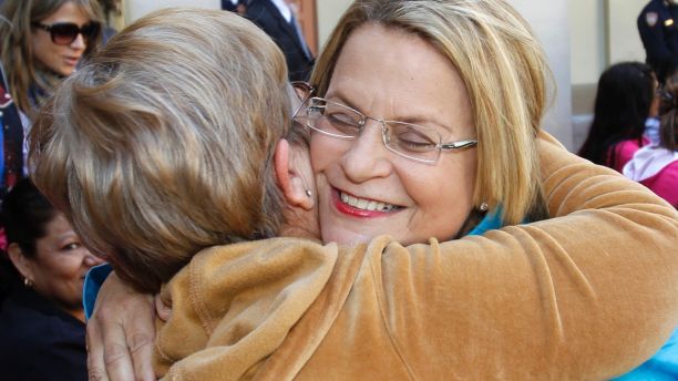 In this photo taken Nov. 9, 2010, Rep. Ileana Ros-Lehtinen, R-Fla., hugs a supporter during a Memorial Day Ceremony in Miami Beach, Fla. (AP Photo/Alan Diaz)