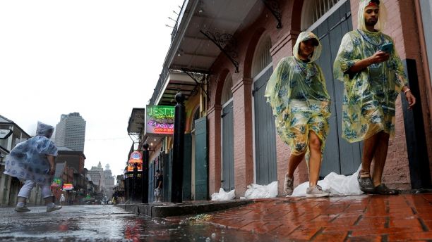 Tourists walk down Bourbon Street as Hurricane Nate approaches the U.S. Gulf Coast in New Orleans, Louisiana, U.S. on October 7, 2017. REUTERS/Jonathan Bachman - RC19ED9B6070