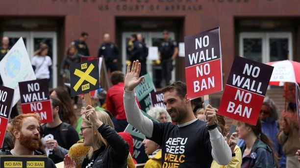 People protest U.S. President Donald Trump's travel ban outside of the U.S. Court of Appeals in Seattle, Washington, U.S. May 15, 2017. REUTERS/David Ryder - RC151FC5E210