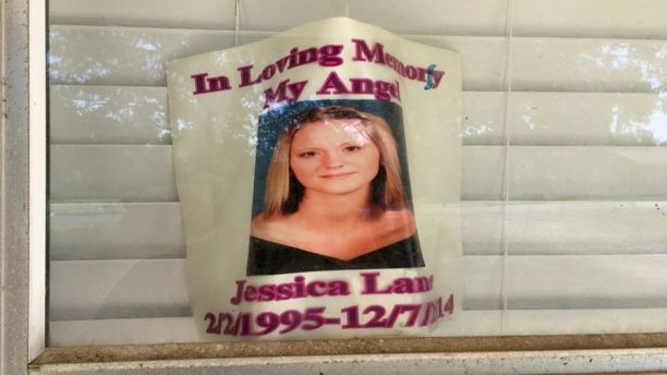 A photo of Jessica Chambers, who was burned to death in December 2014, is taped to the window of her bedroom at her mother's home on Tuesday, Oct. 3, 2017, in Courtland, Miss.  More than three years after her shocking death, Quinton Tellis is set to go on trial, charged with murder. Jury selection is to begin Monday, Oct. 9. He has pleaded not guilty. (AP Photo/Adrian Sainz)