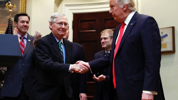 FILE - In this Feb. 16, 2017, file photo, President Donald Trump shakes hands with Senate Majority Leader Mitch McConnell of Ky., during a ceremony in the Roosevelt Room of the White House in Washington. Trumpâs attacks on McConnell come at the worst possible time, if the presidentâs goal is actually to accomplish the agenda on health care, infrastructure and taxes heâs goading his GOP ally to pass. Behind from left are Rep. Evan Jenkins, R-W.Va., and Rep. Jim Jordan, R-Ohio.(AP Photo/Carolyn Kaster, File)