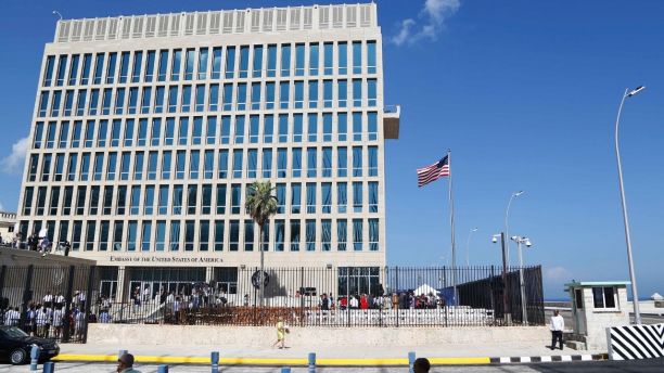 FILE - In this Aug. 14, 2015, file photo, a U.S. flag flies at the U.S. embassy in Havana, Cuba. The Associated Press has obtained a recording of what some U.S. Embassy workers heard in Havana, part of the series of unnerving incidents later deemed to be deliberate attacks. (AP Photo/Desmond Boylan, File)