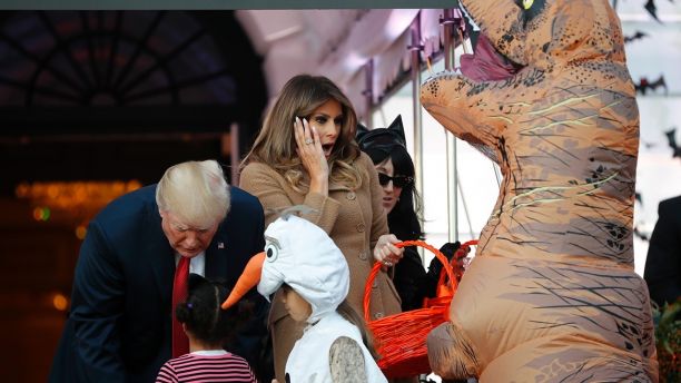 President Donald Trump and first lady Melania Trump hand out treats as they welcome children from the Washington area and children of military families to trick-or-treat celebrating Halloween at the South Lawn of the White House in Washington, Monday, Oct. 30, 2017. (AP Photo/Pablo Martinez Monsivais)