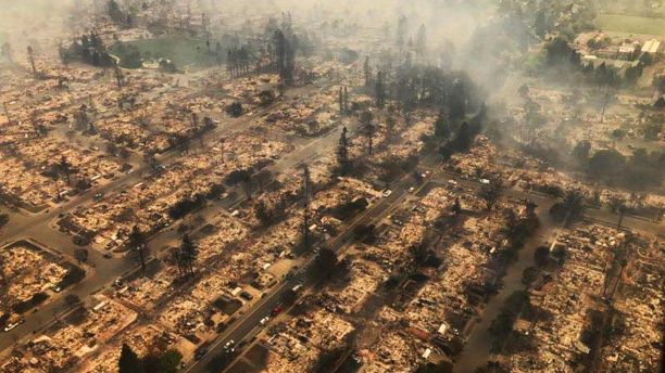 This aerial photo provided by the California Highway Patrol Golden Gate Division shows some of hundreds of homes destroyed in a wind-driven wildfire that swept through Santa Rosa, Calif., early Monday, Oct. 9, 2017. (California Highway Patrol Golden Gate Division via AP)