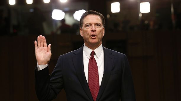 Former FBI Director James Comey is sworn in prior to testifying before a Senate Intelligence Committee hearing on Russia's alleged interference in the 2016 U.S. presidential election on Capitol Hill in Washington, U.S., June 8, 2017. REUTERS/Jonathan Ernst - HP1ED681C66SA