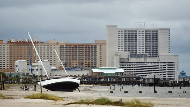 A sail boat is beached near Margaritaville and the Golden Nugget in Biloxi, Miss., Sunday, Oct. 8, 2017, after Hurricane Nate made landfall on the Gulf Coast.  (Justin Sellers/The Clarion-Ledger via AP)
