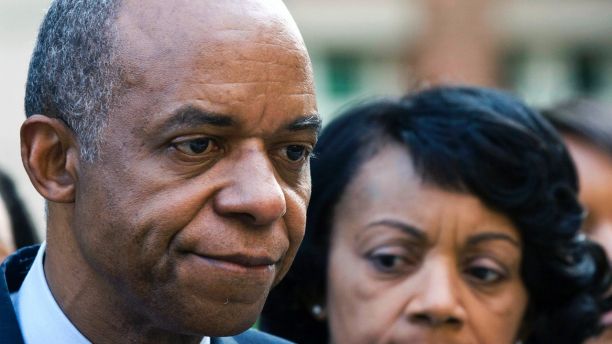 FILE - In this Wednesday, Aug. 5, 2009, file photo, former Louisiana congressman William Jefferson, left, stands outside the Albert V. Bryan Courthouse with his wife, Andrea after being convicted on 11 of 16 counts in Alexandria, Va. A federal judge has ordered that Jefferson, sentenced to 13 years in prison for taking bribes, be released from jail pending a new sentencing hearing. (AP Photo/Kevin Wolf, File)