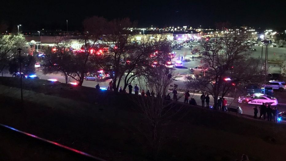 Emergency personnel respond to a shooting at a Walmart Super Center in Thornton, Colo.