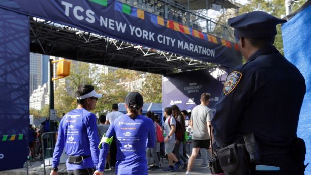 A New York City police office stands near the finish line of the New York City Marathon, in New York's Central Park, Friday, Nov. 3, 2017. New York City police say they're prepared with increased security for the marathon this weekend, days after eight people were killed not far from the World Trade Center in a terrorist attack when a man driving a rented truck mowed people down on a bicycle path. (AP Photo/Richard Drew)
