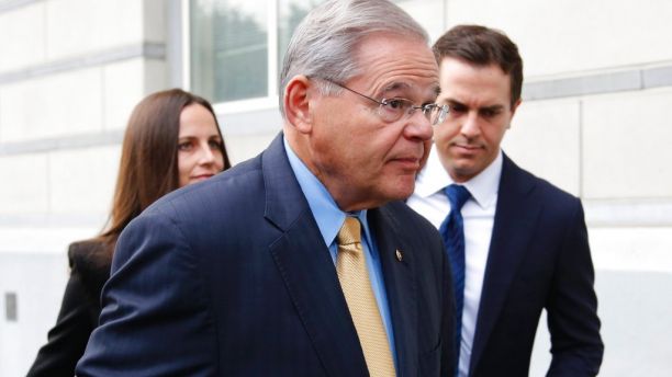 Sen. Bob Menendez, center, arrives to the courthouse with his children, Alicia Menendez and Robert Menendez Jr., in Newark, N.J., Wednesday, Sept. 6, 2017. The corruption trial for the New Jersey Democrat and a wealthy Florida eye doctor begins on Wednesday in Newark. The trial will examine whether Menendez was illegally lobbying for Salomon Melgen, who gave him political contributions and gifts including luxury vacations. (AP Photo/Seth Wenig)