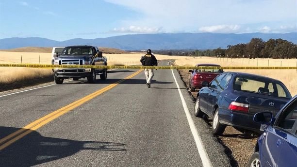Crime tape blocks off Rancho Tehama Road leading into the Rancho Tehama subdivision south of Red Bluff, Calif., following a fatal shooting on Tuesday, Nov. 14, 2017. (Jim Schultz/The Record Searchlight via AP)