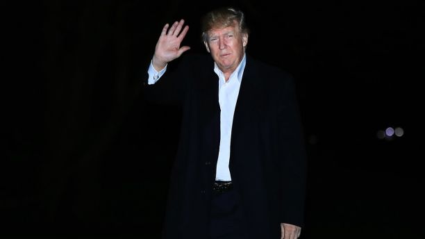 President Donald Trump waves as he walks on the South Lawn upon his return to the White House in Washington, from a five-nation Asia tour, Tuesday, Nov. 14, 2017. (AP Photo/Manuel Balce Ceneta)