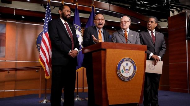 Rep. Luis Gutierrez (D-IL), accompanied by Rep. Al Green (D-TX), Rep. Steve Cohen (D-TN) and Rep. Adriano Espaillat (D-NY), speaks at a press conference announcing articles of impeachment being filed against President Donald Trump on Capitol Hill in Washington, U.S., November 15, 2017. REUTERS/Aaron P. Bernstein - RC199D369DD0