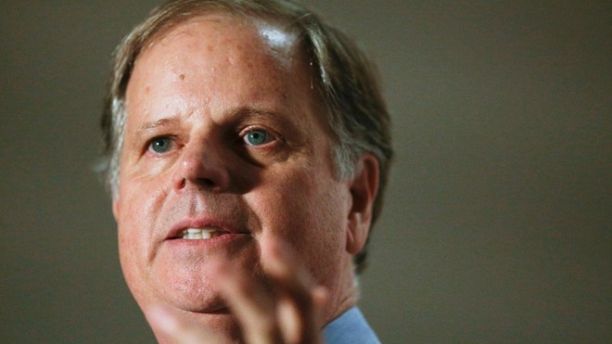 FILE - In this Tuesday, Oct. 3, 2017 file photo, Democrat Doug Jones speaks at a campaign rally for the race to fill Attorney General Jeff Sessions' former Senate seat, in Birmingham, Ala. Jones is betting that his underdog bid for the U.S. Senate gets a boost, at home and nationally, from his role in convicting two Ku Klux Klansmen who killed four young black girls in the 1963 bombing of Birmingham's 16th Street Baptist Church. (AP Photo/Brynn Anderson, File)