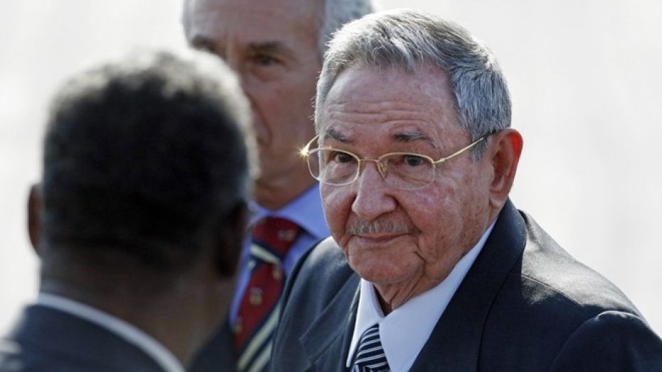 Cuba's President Raul Castro makes his way to a waiting car after arriving in Santiago, Chile, Jan. 25, 2013.