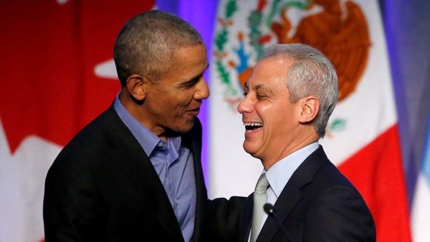 Former President Barack Obama, left, shares a laugh with Chicago Mayor Rahm Emanuel after Emanuel introduced Obama at a summit on climate change involving mayors from around the globe Tuesday, Dec. 5, 2017, in Chicago. The conference comes after President Trump said the U.S. will pull out of the Paris agreement. (AP Photo/Charles Rex Arbogast)