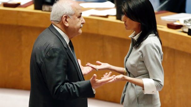Palestinian Ambassador to the United Nations Riyad Mansour, left, and U. S. Ambassador Nikki Haley confer before a Security Council meeting at United Nations headquarters, Friday, Dec. 8, 2017. (AP Photo/Richard Drew)
