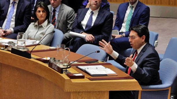 Israel's U.N. Ambassador Danny Dannon, right, speaks in the Security Council as U.S. Ambassador Nikki Haley, left, listens at United Nations headquarters, Friday, Dec. 8, 2017. (AP Photo/Richard Drew)
