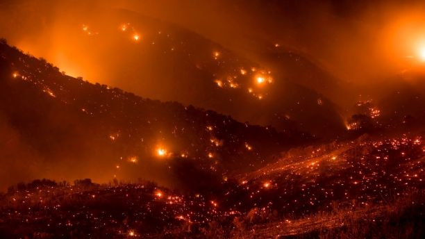 A hillside glows with embers as the Thomas fire burns through Los Padres National Forest near Ojai, Calif., on Friday, Dec. 8, 2017. (AP Photo/Noah Berger)