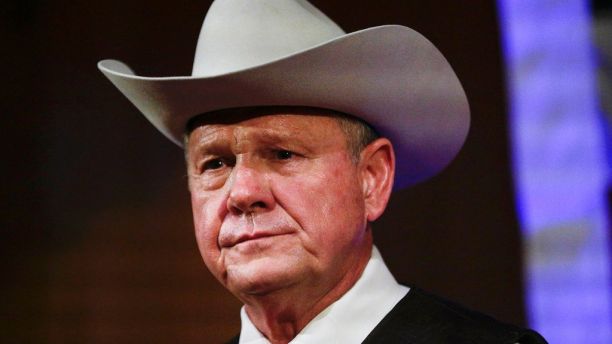 FILE - In this Monday, Sept. 25, 2017, file photo, former Alabama Chief Justice and U.S. Senate candidate Roy Moore speaks at a rally, in Fairhope, Ala. President Donald Trump in tweets Sunday, Nov. 26, is again coming to the side of Moore by bashing the Democratic nominee Doug Jones in the Alabama Senate race. (AP Photo/Brynn Anderson, File)